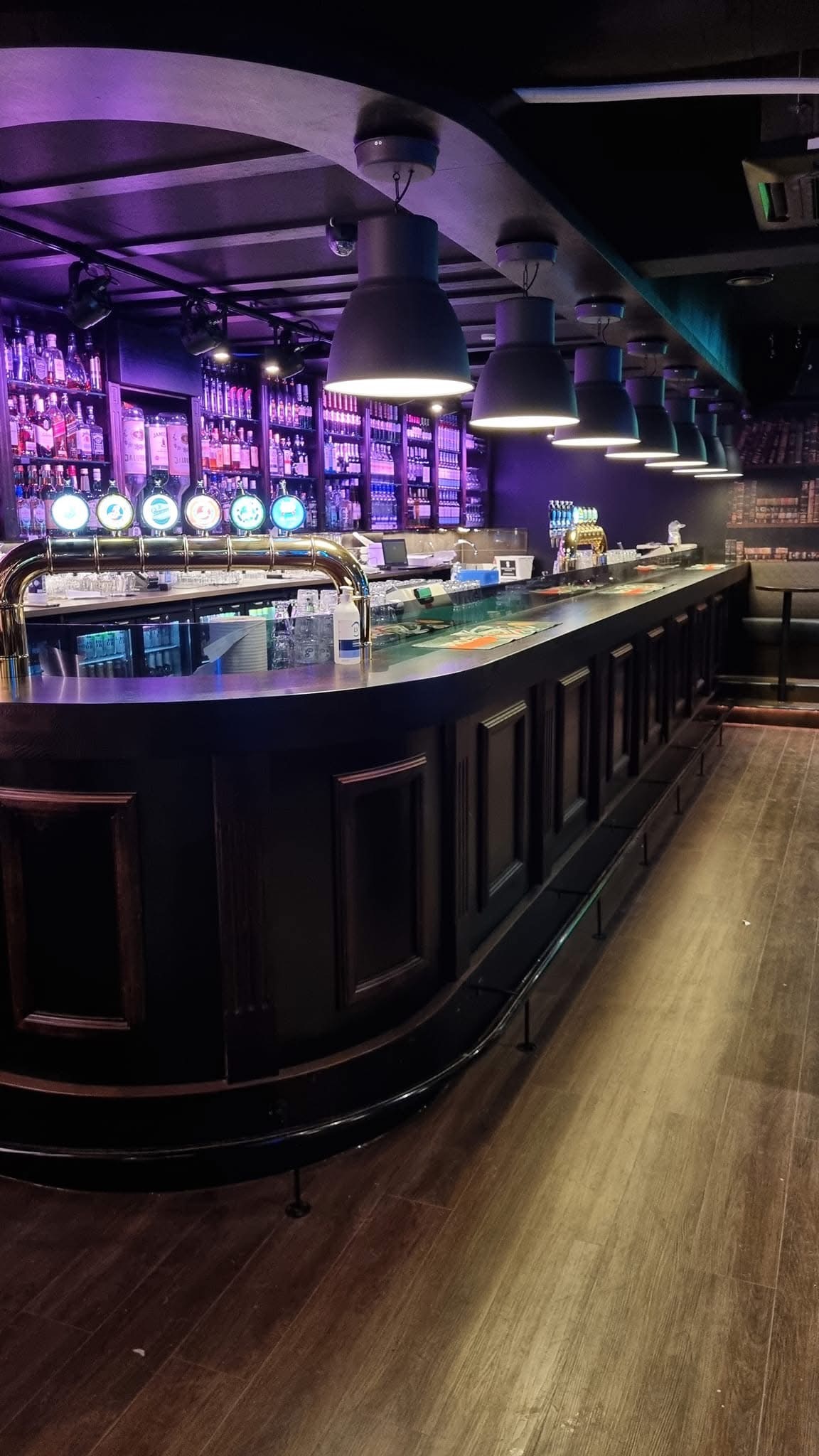 Cozy bar interior with bottles and ambient lighting